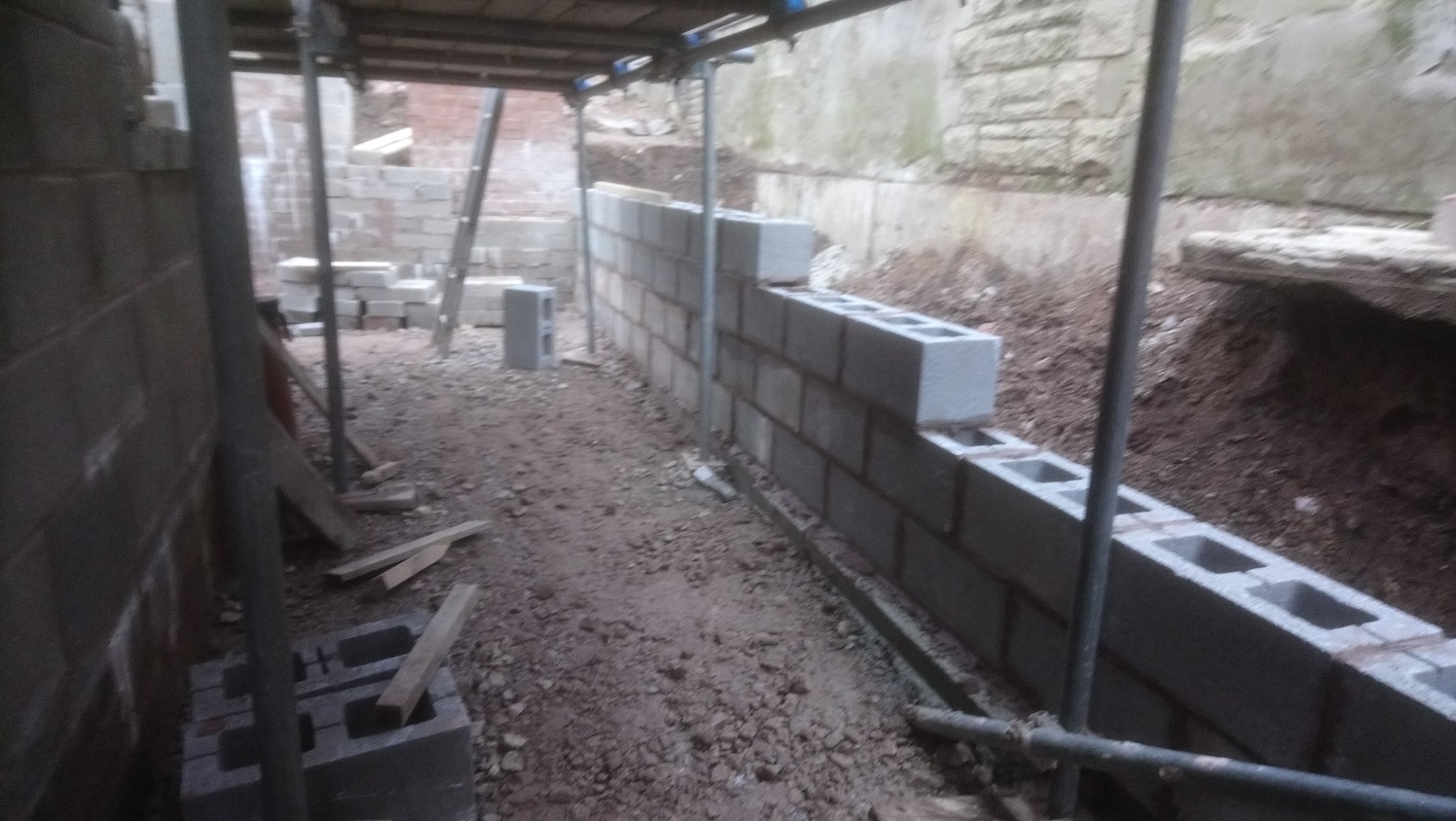 Build parallel to retaining wall